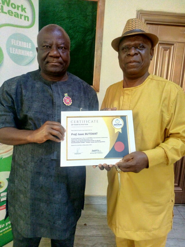 DVC, NOUN, Prof Butswat receiving his Certificate